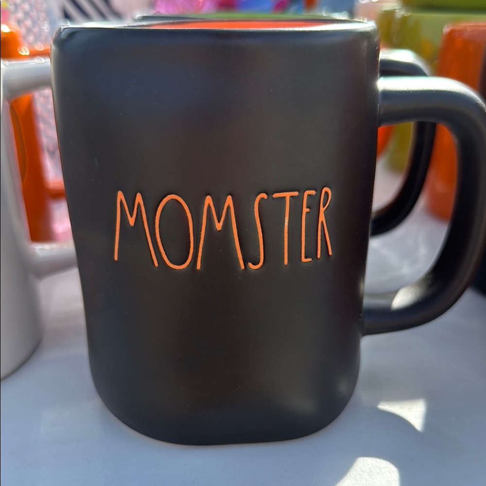 Black Mug with Orange 'MOMSTER' Design